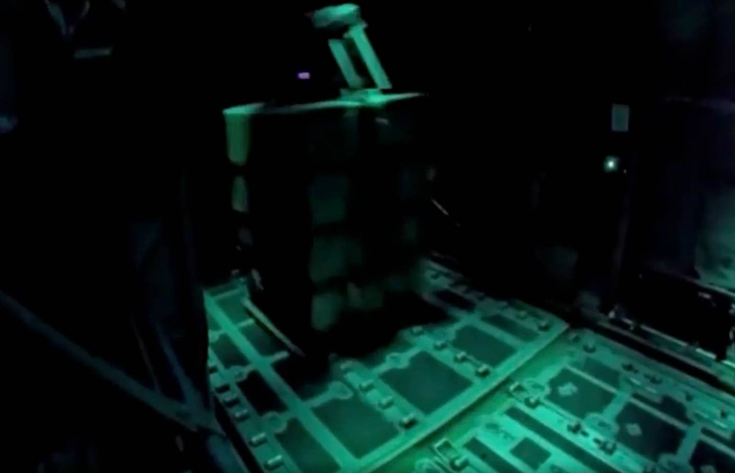 A container of water features a device on top that could be an autonomous guidance system. (IDF video screencap)