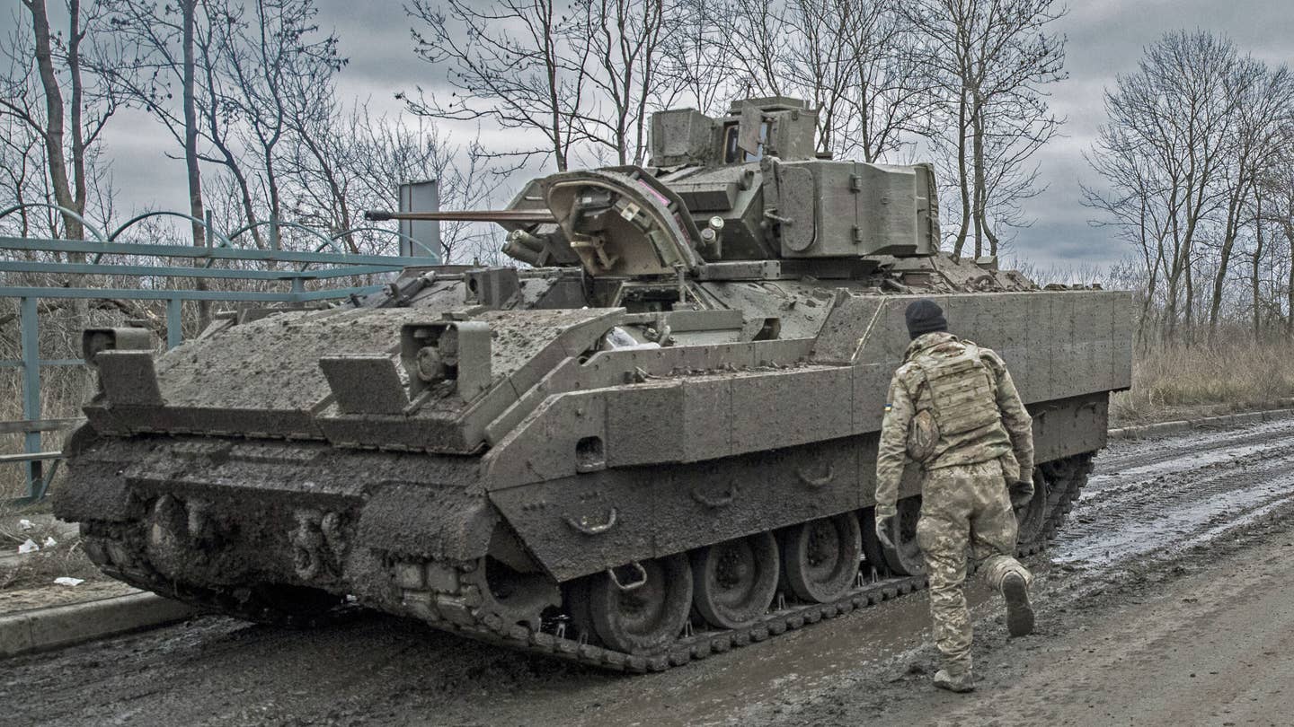 A Ukrainian soldier is seen near a Bradley Fighting vehicle as the Russia-Ukraine war continues in Avdiivka, Donbas, Ukraine on December 4, 2023.