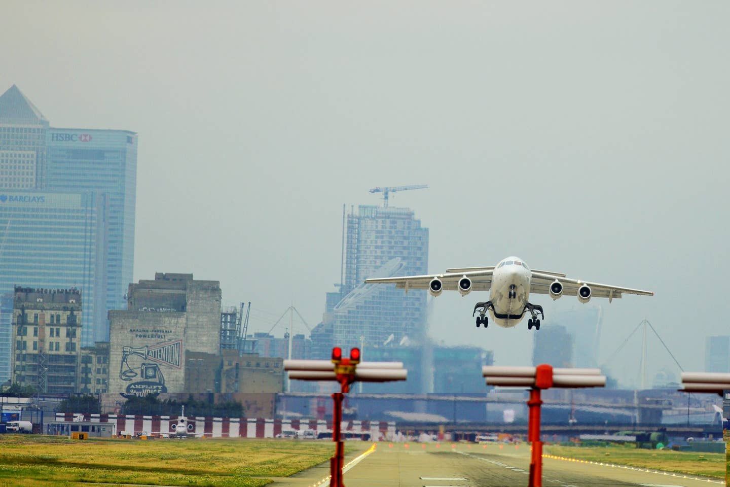 One of the few STOL-capable regional jets to have found market was the Avro RJ series. This CityJet Avro RJ85 is seen taking off from London City Airport in August 2015. <em>Aleem Yousaf/Wikimedia Commons</em>