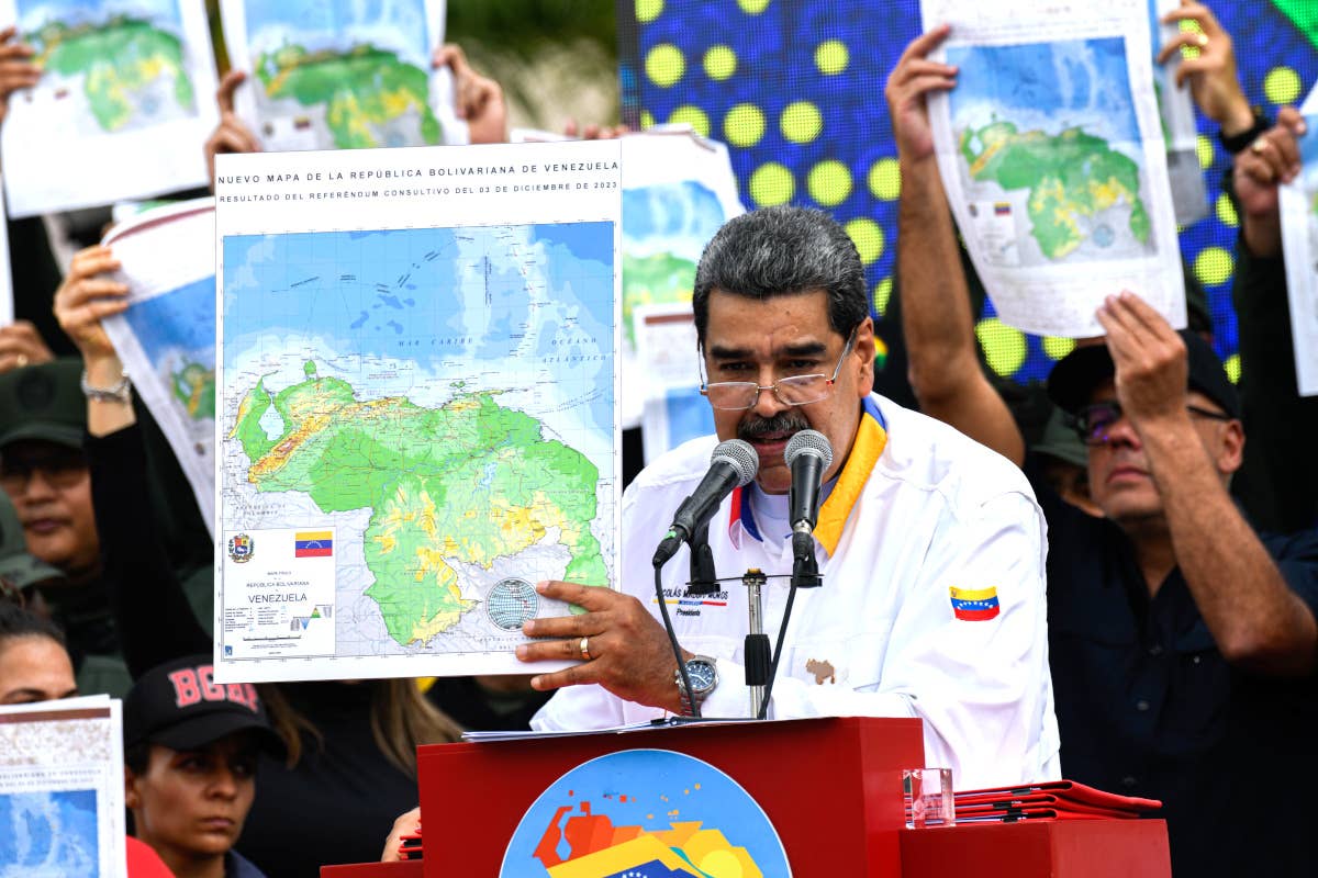 Venezuela's dictatorial President Nicolas Maduro holds a map showing Essequibo as part of Venezuela at a rally on December 8, 2023. <em>Mariela Lopez/Anadolu via Getty Images</em>