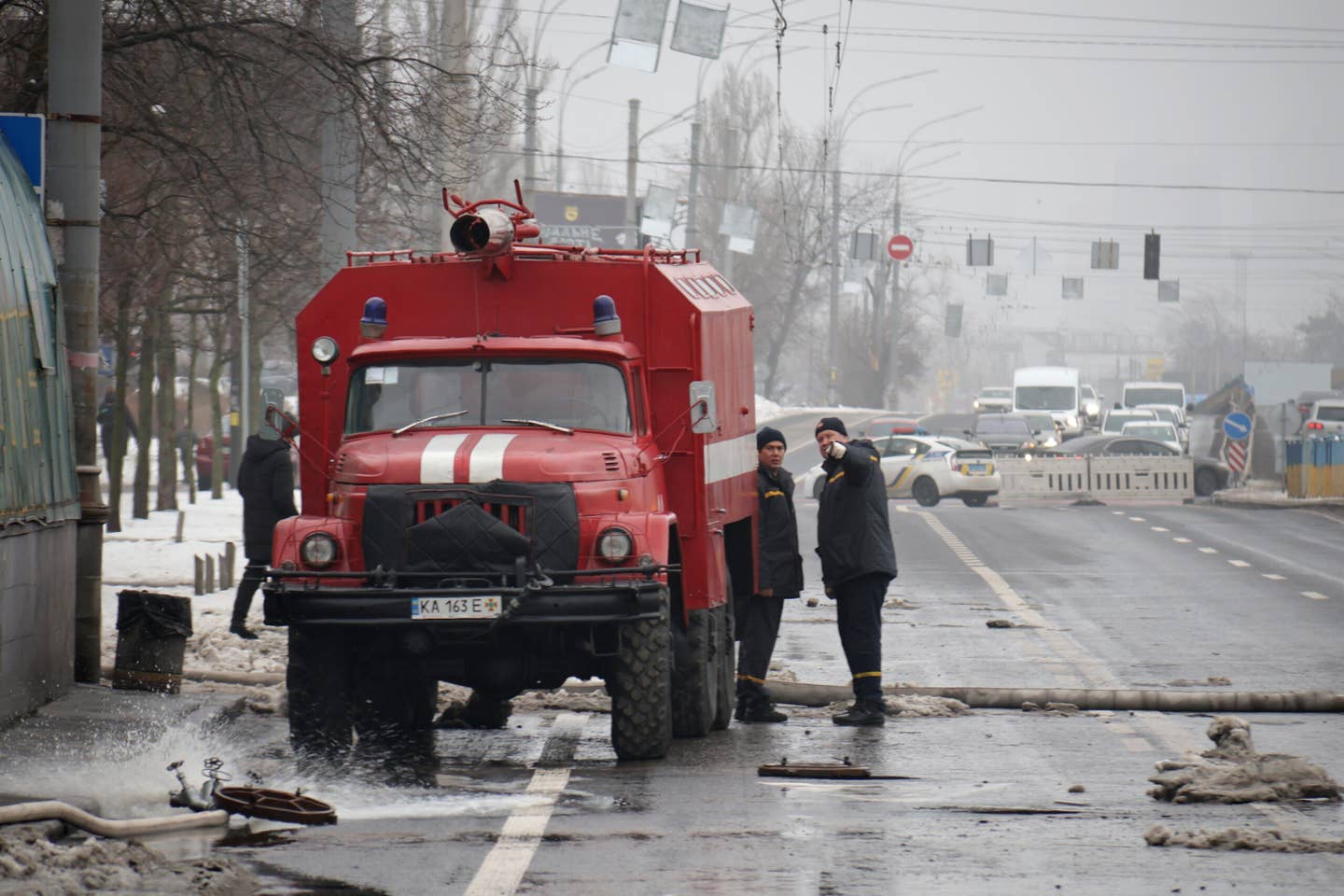 Emergency services dealing with damage caused by falling missile debris on Voskresenskyi Avenue in Kyiv, Ukraine, on December 13, 2023. <em>Photo by Ukrinform/NurPhoto via Getty Images</em>