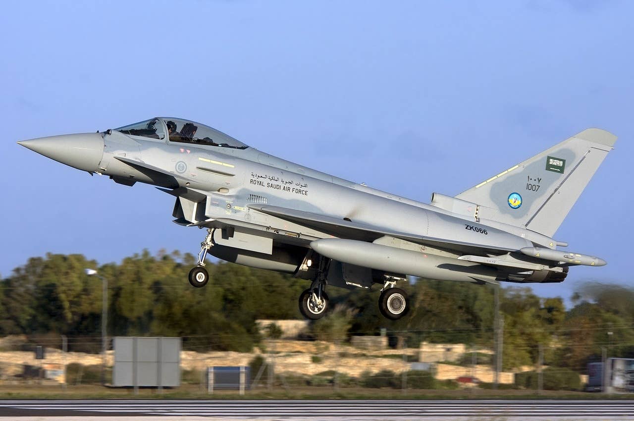 A Royal Saudi Air Force Eurofighter Typhoon passes through Luqa, Malta, during its delivery flight from the United Kingdom in December 2009. <em>Gordon Zammit/Wikimedia Commons</em>
