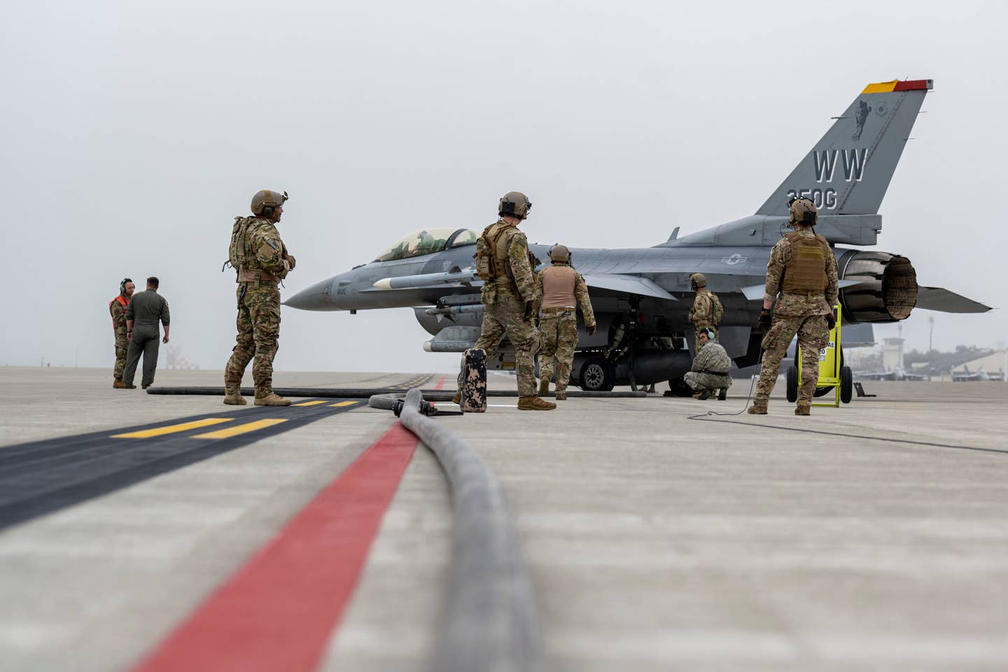 Airmen from the 18th Logistic Readiness Squadron and 1st Special Operations Squadron from Kadena Air Base, Japan, refuel an F-16C during a forward area refueling point training at Misawa Air Base, Japan, June 25, 2020. <em>U.S. Air Force photo by Staff Sgt. Melanie A. Bulow-Gonterman</em>
