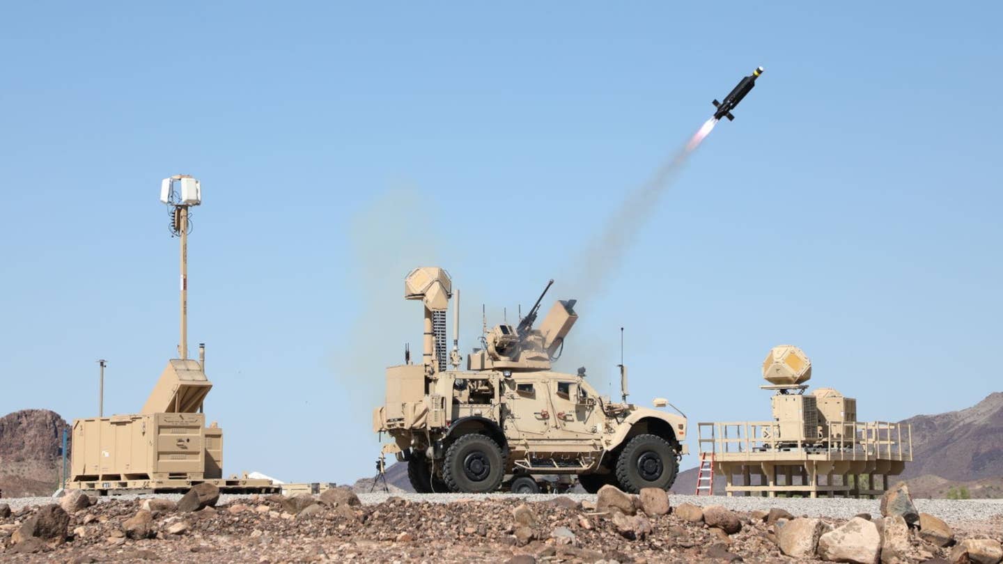 A promotional shot showing the FS-LIDS launcher and radar components, as well as an M-LIDS vehicle in the middle. <em>Raytheon</em>