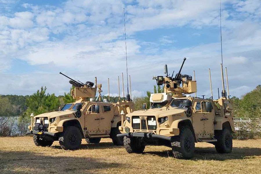 US Marine Corps Marine Air Defense Integrated System (MADIS) counter-drone vehicles equipped with remote weapon stations armed with 30mm automatic cannons. The example in the foreground also has an AESA radar array. <em>USMC</em> USMC