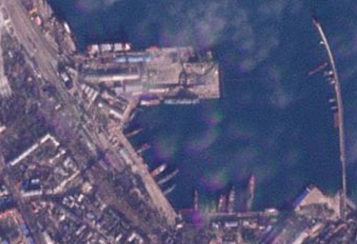 Planet Labs imagery taken on the 24th shows the planform of a <em>Ropucha</em> class ship docked where the ship is seen burning in imagery after the blast. <em>PHOTO © 2023 PLANET LABS INC. ALL RIGHTS RESERVED. REPRINTED BY PERMISSION</em>