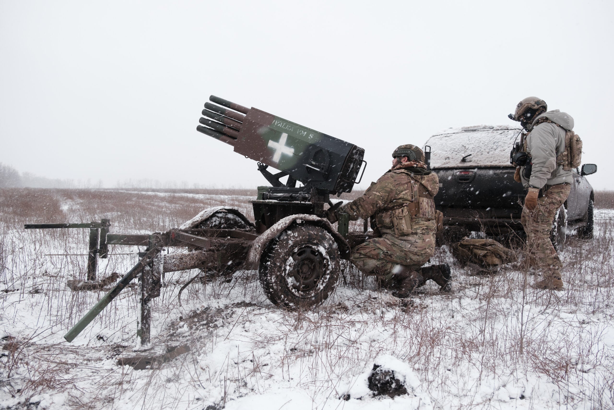 DONETSK OBLAST, UKRAINE - DECEMBER 25: Ukrainian soldiers of the 28th Mechanized Brigade prepare an improvised multiple rocket for firing on Russian position on December 25, 2023 in Donetsk Oblast, Ukraine. (Photo by Vitalii Nosach/Global Images Ukraine via Getty Images)