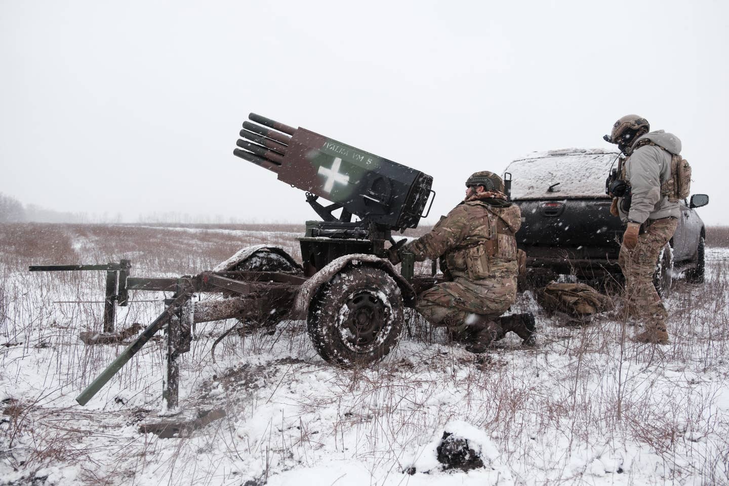Ukrainian soldiers of the 28th Mechanized Brigade prepare an improvised multiple rocket launcher for firing on a Russian position on December 25, 2023, in the Donetsk region, Ukraine. <em>Photo by Vitalii Nosach/Global Images Ukraine via Getty Images</em>