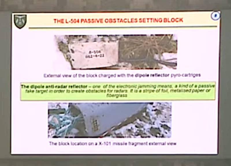 A close-up of the English-language briefing slide about the countermeasures capabilities found on the recovered Kh-101. Though blurry, key information is still legible. <em>Armed Forces of Ukraine capture</em>