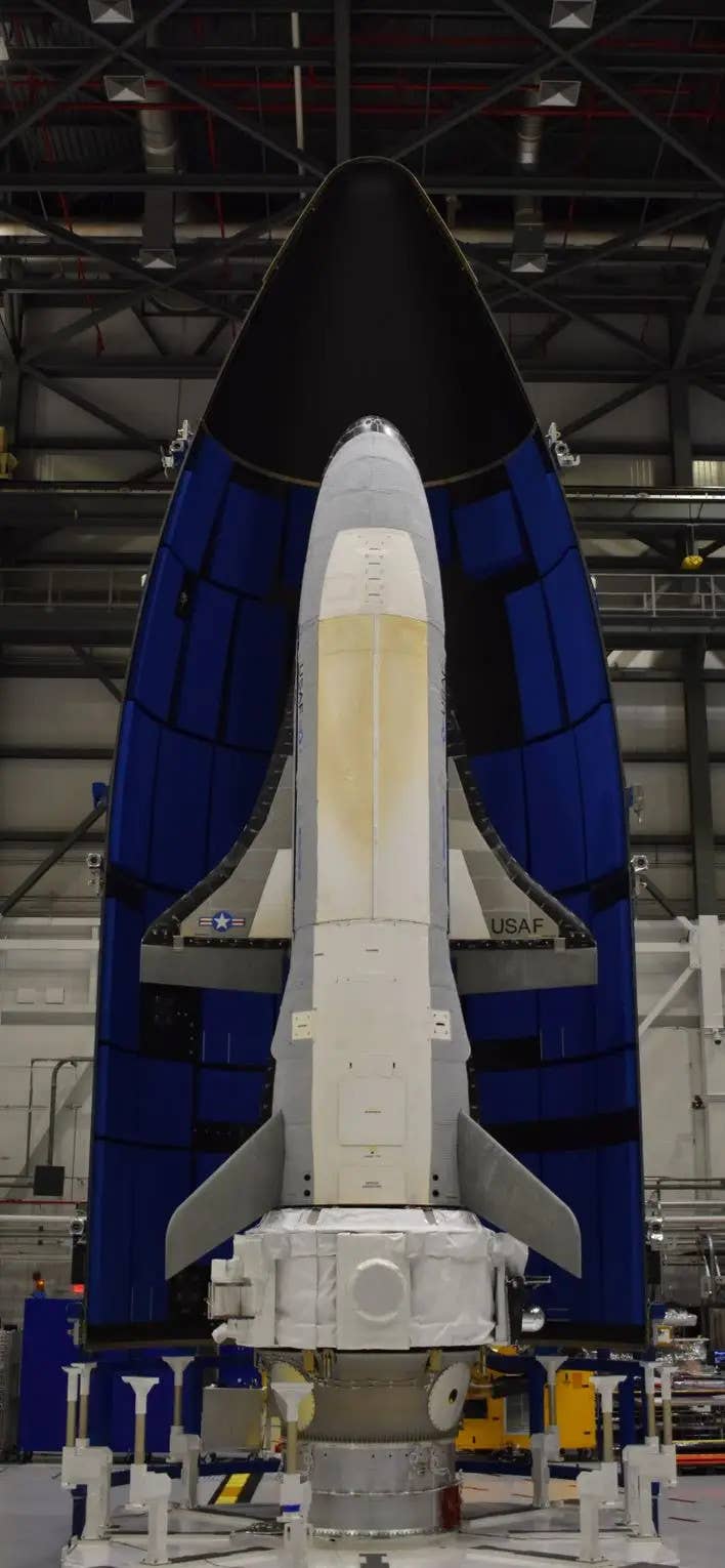 The X-37B used for the OTV-6 mission seen ahead of its launch in 2020 with the service module attached to its tail-end. This picture was released in November 2022 after OTV-6's conclusion. <em>U.S. Space Force </em>