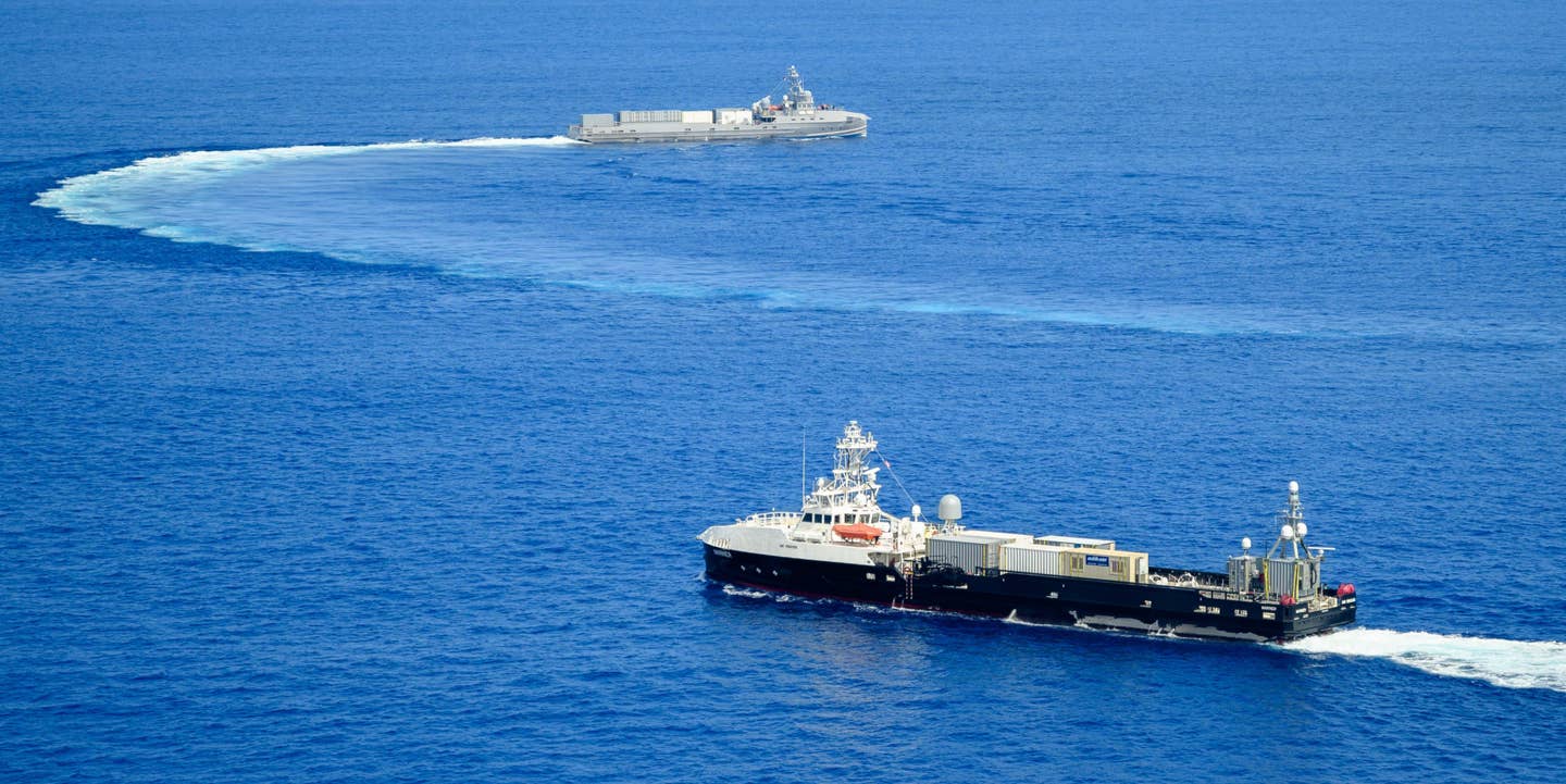 Ranger, in the background, and Mariner, in the foreground, sail together in the Pacific in 2023. <em>USN</em>