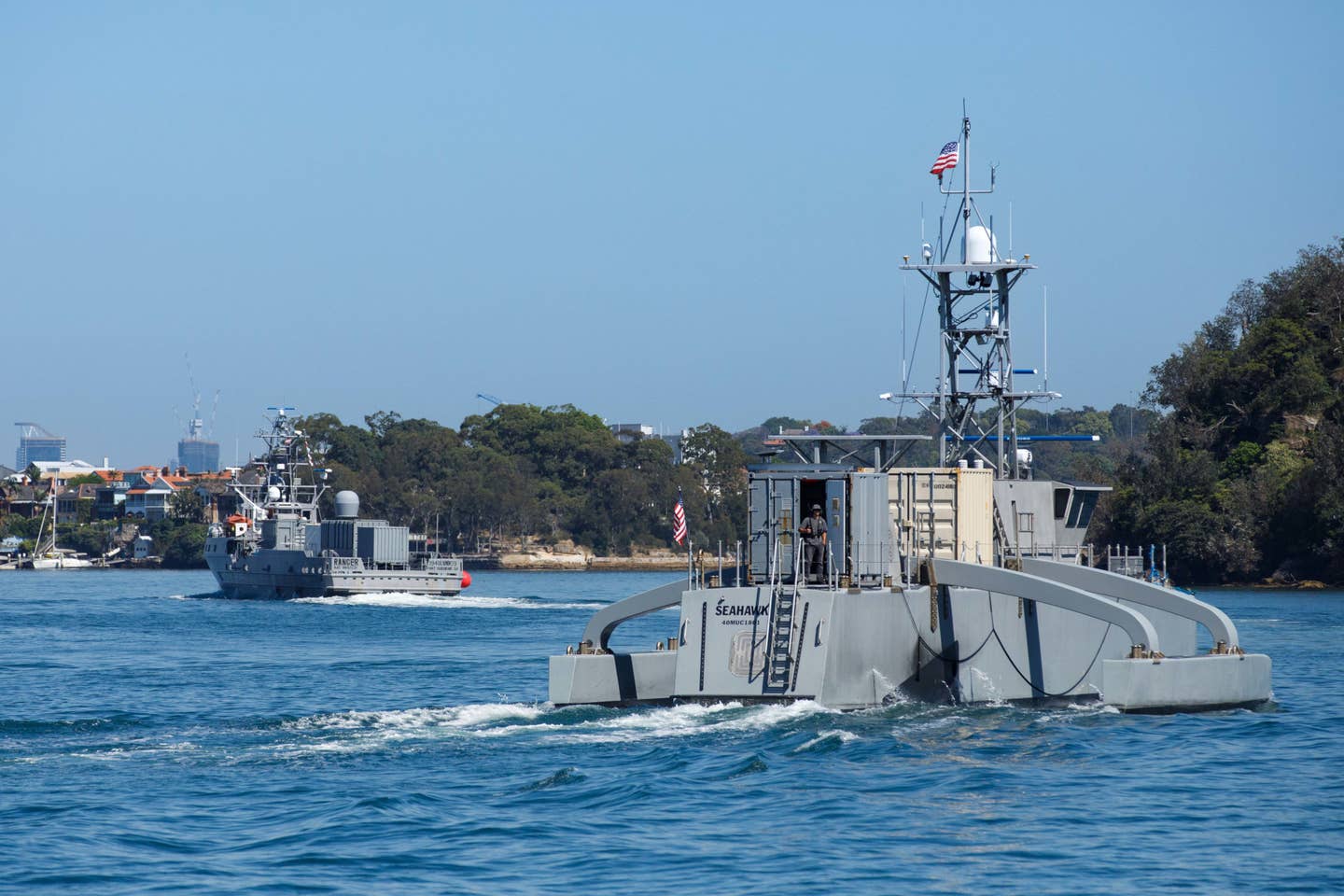 Ranger, in the background, along with the Seahawk medium USV, in Sydney Harbor ahead of Exercise Autonomous Warrior 2023.<em> USN</em>