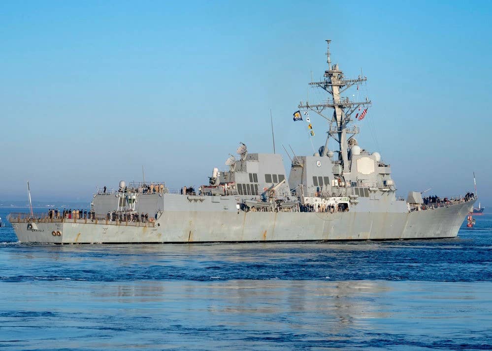 A helicopter from the <em>Arleigh Burke</em> class guided missile destroyer <em>USS Gravely</em> took part in an attack on Houthi ships menacing a commercial vessel in the Red Sea. Photo by Petty Officer 1st Class Ryan Seelbach