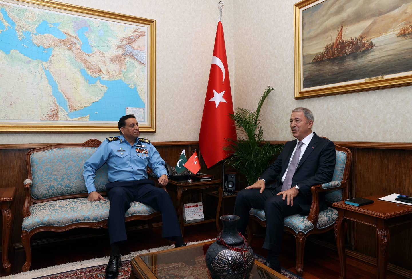 Turkish Minister of Defense Hulusi Akar (right) and Pakistan Air Force chief ACM Zaheer Sidhu (left) pose for a photo during a meeting in Ankara, Turkiye on October 1, 2022. <em>Photo by Arif Akdogan/Anadolu Agency via Getty Images</em>