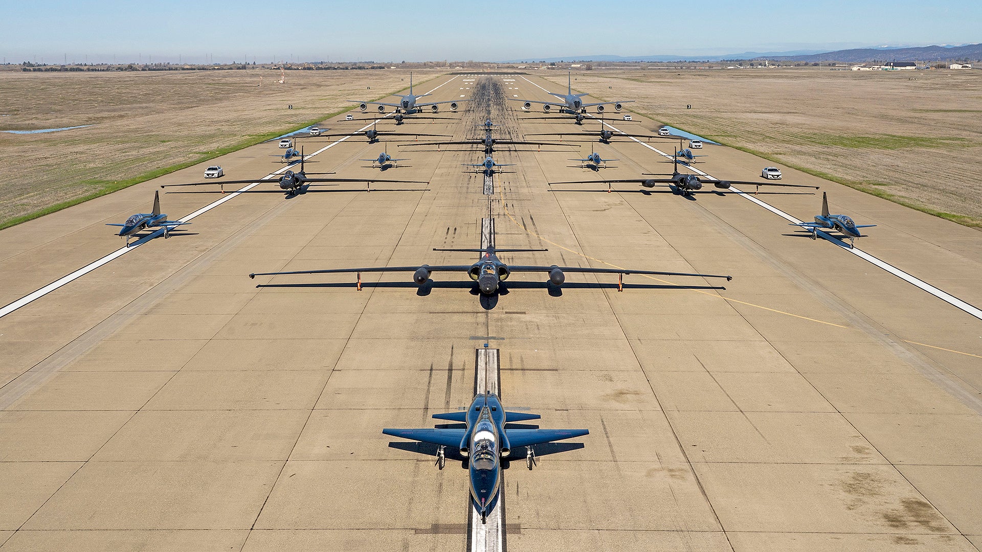 U.S. Air Force U-2 Dragon Lady’s and chase cars from the 99th Reconnaissance Squadron, T-38 Talon’s from the 1st Reconnaissance Squadron, and KC-135R Stratotanker’s from the 940th Air Refueling Wing conduct an elephant walk on Beale Air Force Base, California, Jan. 4, 2023. The elephant walk showcased a display of joint airpower between the wings hosted at Beale. (U.S. Air Force photo by Senior Airman Juliana Londono)