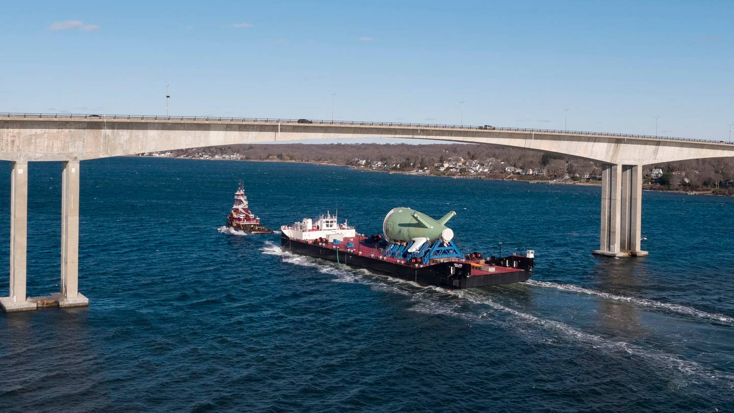The first Columbia class submarine stern rides underneath the Jamestown Verrazzano Bridge heading to the General Dynamics Electric Boat plant in Quonset Point, Rhode Island. (General Dynamics Electric Boat)