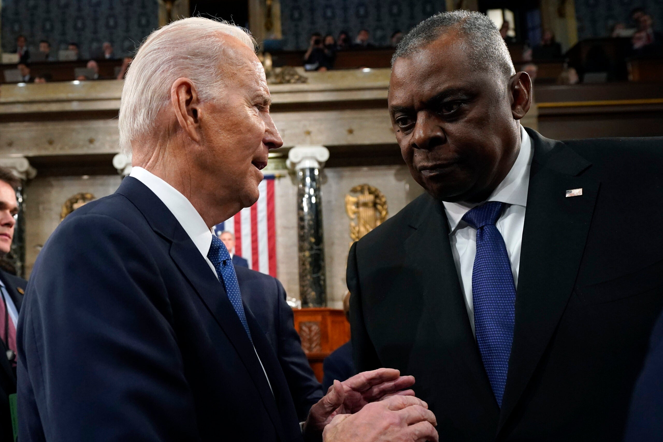 WASHINGTON, DC - FEBRUARY 07: U.S. President Joe Biden talks with Defense Secretary Lloyd Austin after delivering the State of the Union address on February 7, 2023 in the House Chamber of the U.S. Capitol in Washington, DC. The speech marks Biden's first address to the new Republican-controlled House. (Photo by Jacquelyn Martin-Pool/Getty Images)