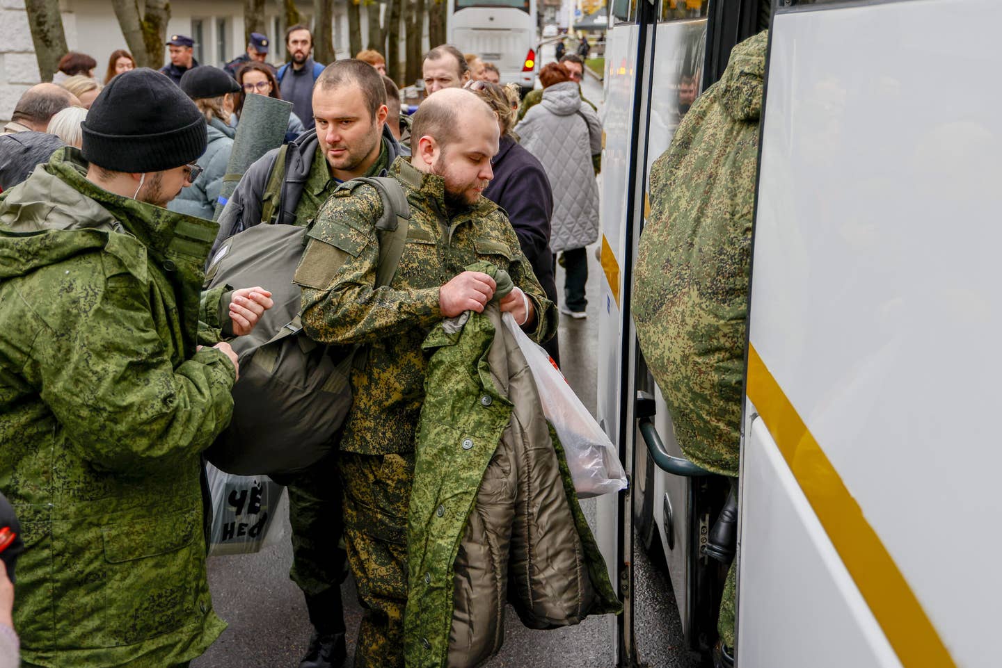 Russian recruits gather outside a military processing center as drafted men say goodbye to their families before departing from their town in Moscow, in October 2022. <em>Photo by Sefa Karacan/Anadolu Agency via Getty Images</em>