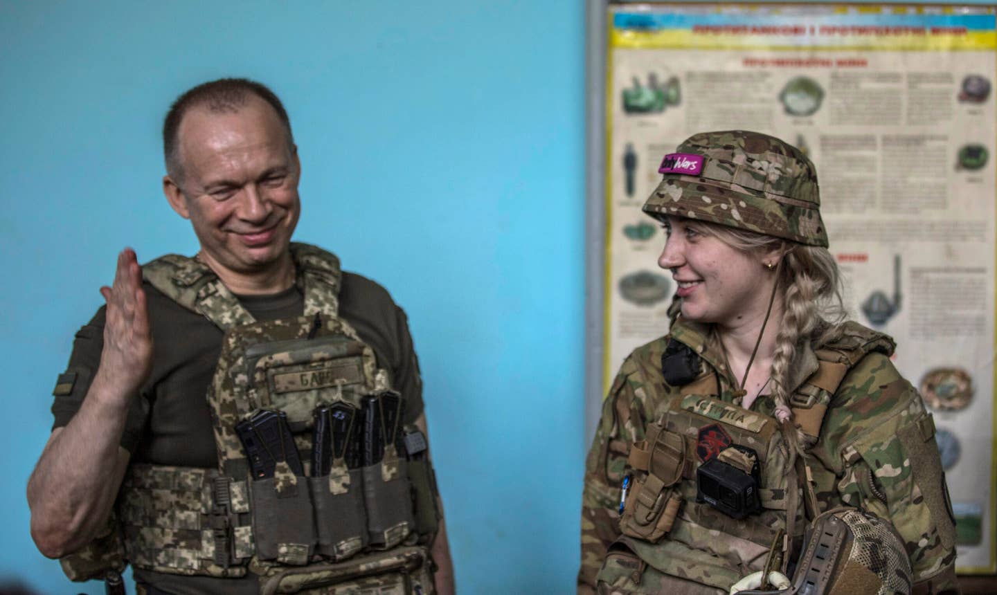 Oleksandr Syrskyi (left), the commander of the Ukrainian Ground Forces, awards Ukrainian fighters of the 10th Mountain Assault Brigade “Edelweiss” in the Soledar direction on July 2, 2023, in the Donetsk region, Ukraine. <em>Photo by Yuriy Mate/Global Images Ukraine via Getty Images</em>