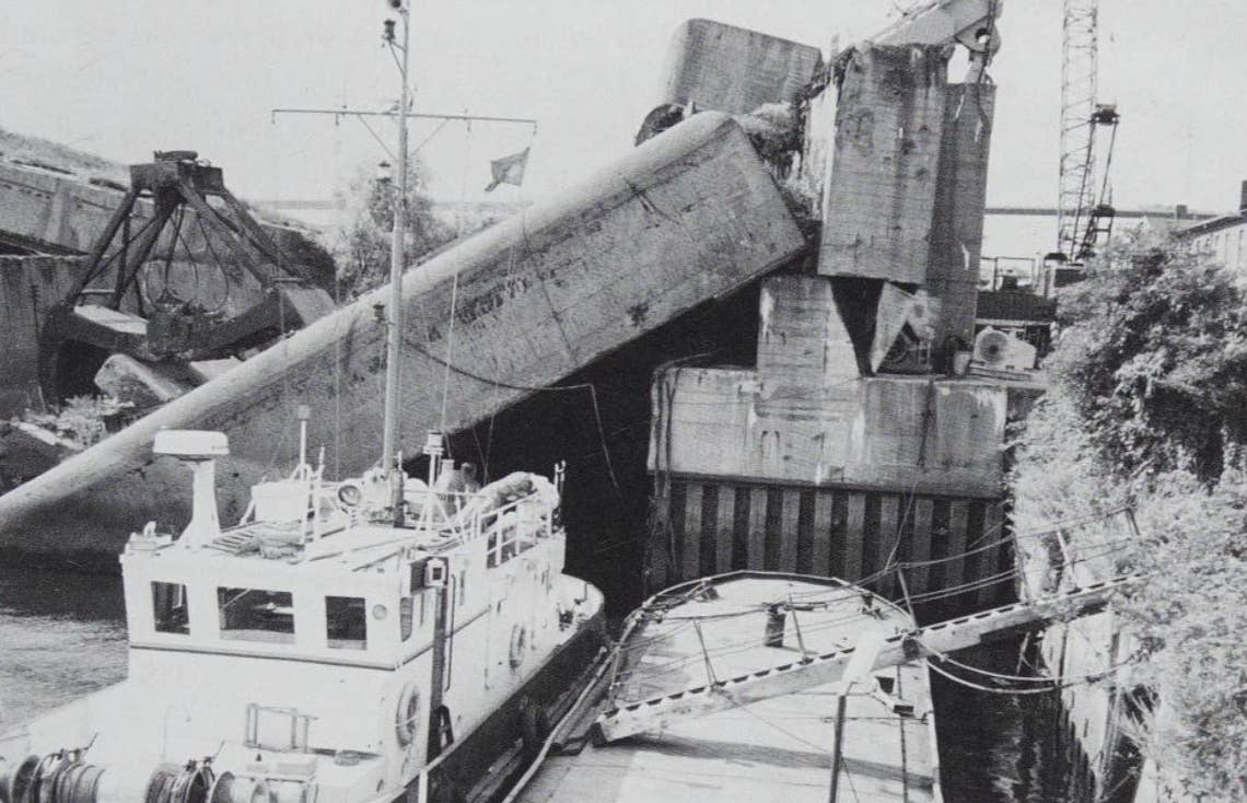 Front of Elbe II, showing the demolished western wall and sloping roof, with the three subs still underneath it, at the start of the 21st century. <em>Jak P. Mallmann-Showell</em>