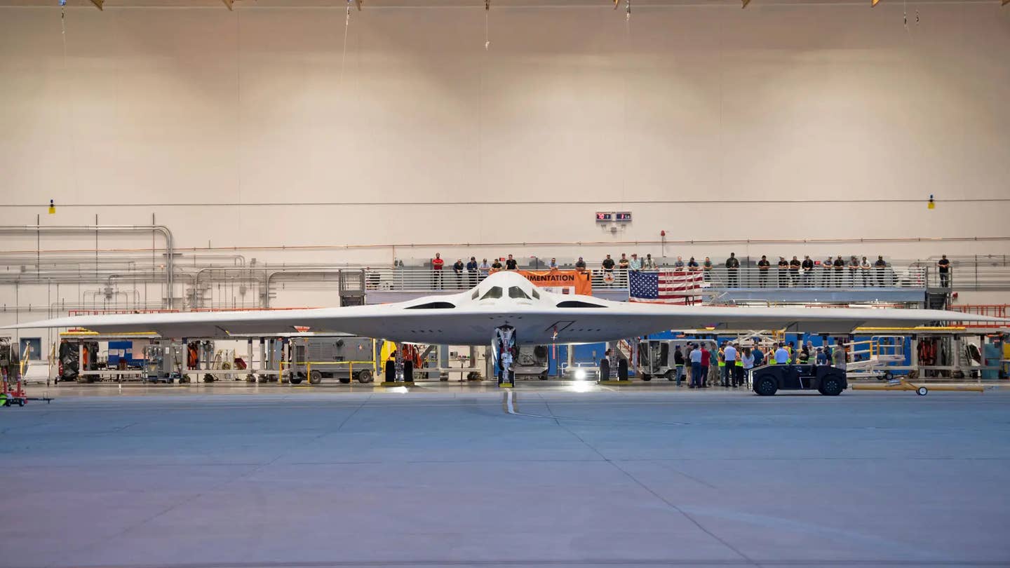 The first pre-production B-21 in a hangar at Northrop Grumman's facilities at the US Air Force's Plant 42 in Palmdale, California, in 2023. <em>USAF</em>