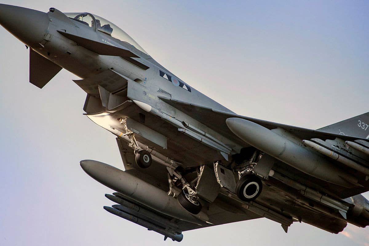 A U.K. Royal Air Force Typhoon takes off, loaded with Meteor missiles below the fuselage. <em>Crown Copyright</em><br>
