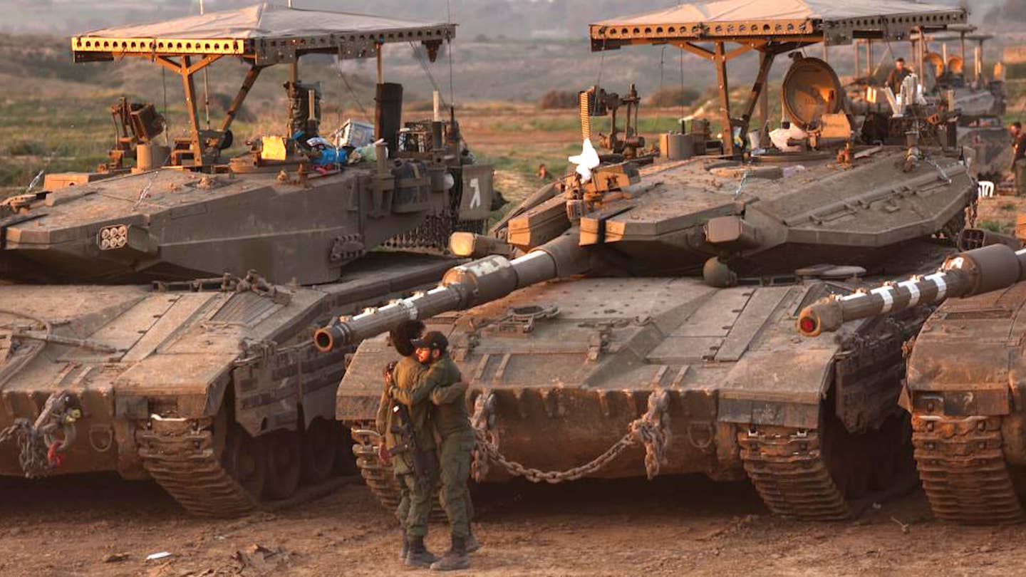 Israeli Merkava Mk 3 tanks with various additional defensive features parked in southern Israel near Gaza on January 21, 2024. <em>Gil Cohen Magen/Xinhua</em>