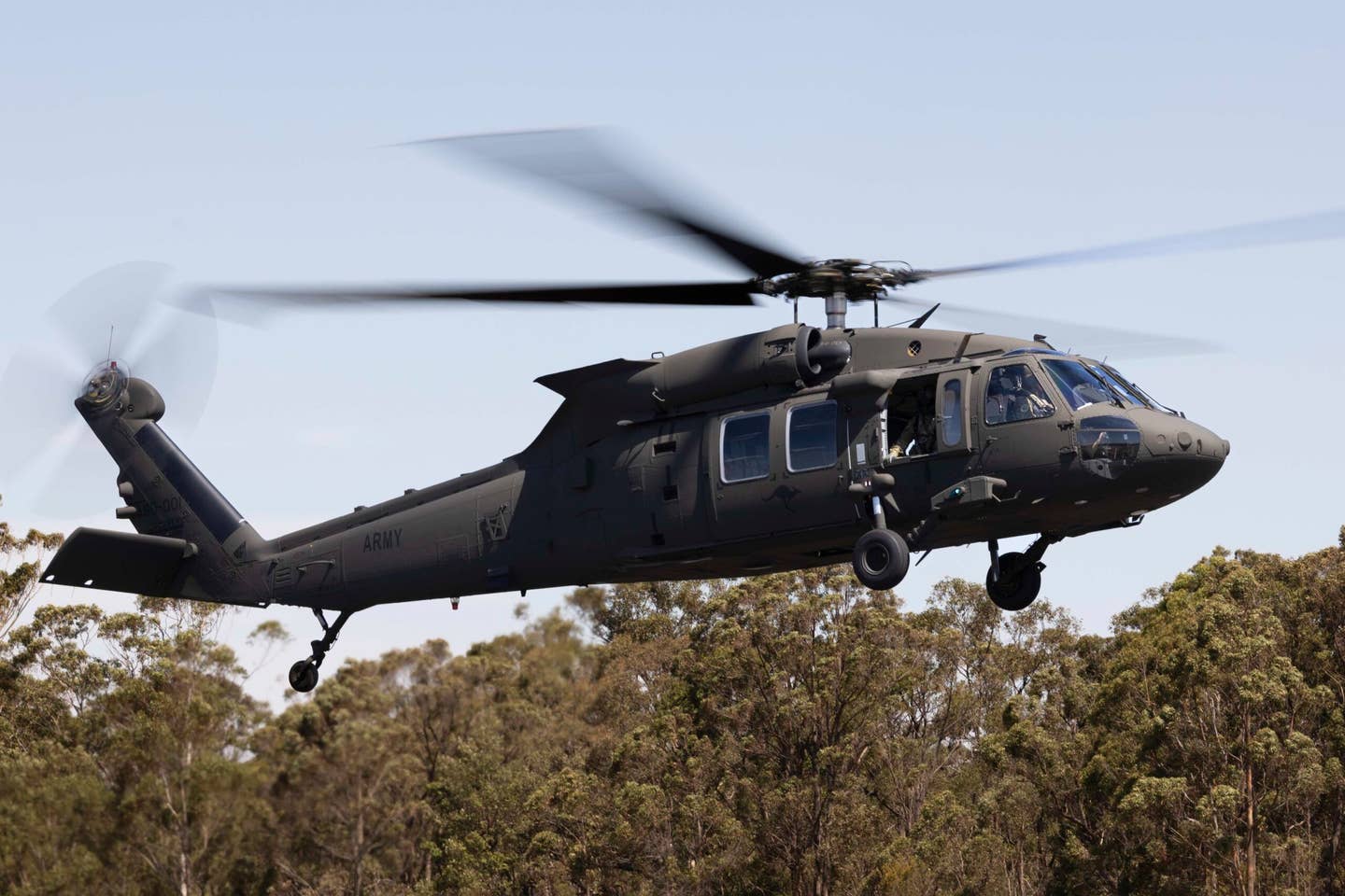 One of the first flights of the Australian Army’s three early delivery UH-60M Black Hawk helicopters, conducted by the 6th Aviation Regiment’s 171st Special Operations Squadron, out of Luscombe Army Airfield in Sydney. <em>Commonwealth of Australia, Department of Defense</em>