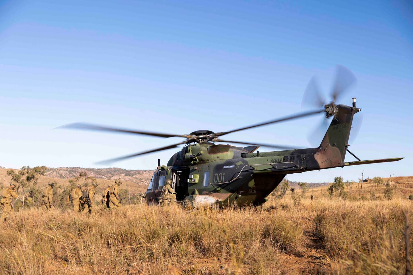 An Australian Army NH-90 Tactical Transport Helicopter conducts a casevac Aeromedical Evacuation exercise with Australian Army infantry during training in 2020. <em>Commonwealth of Australia, Department of Defense</em>