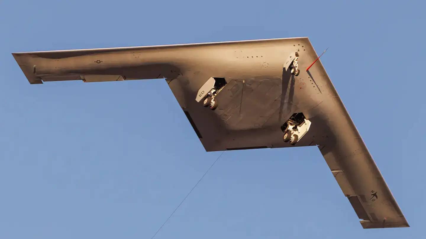 The first pre-production B-21 Raider seen from below during its first flight in November 2023. <em>Andrew Kanei</em>