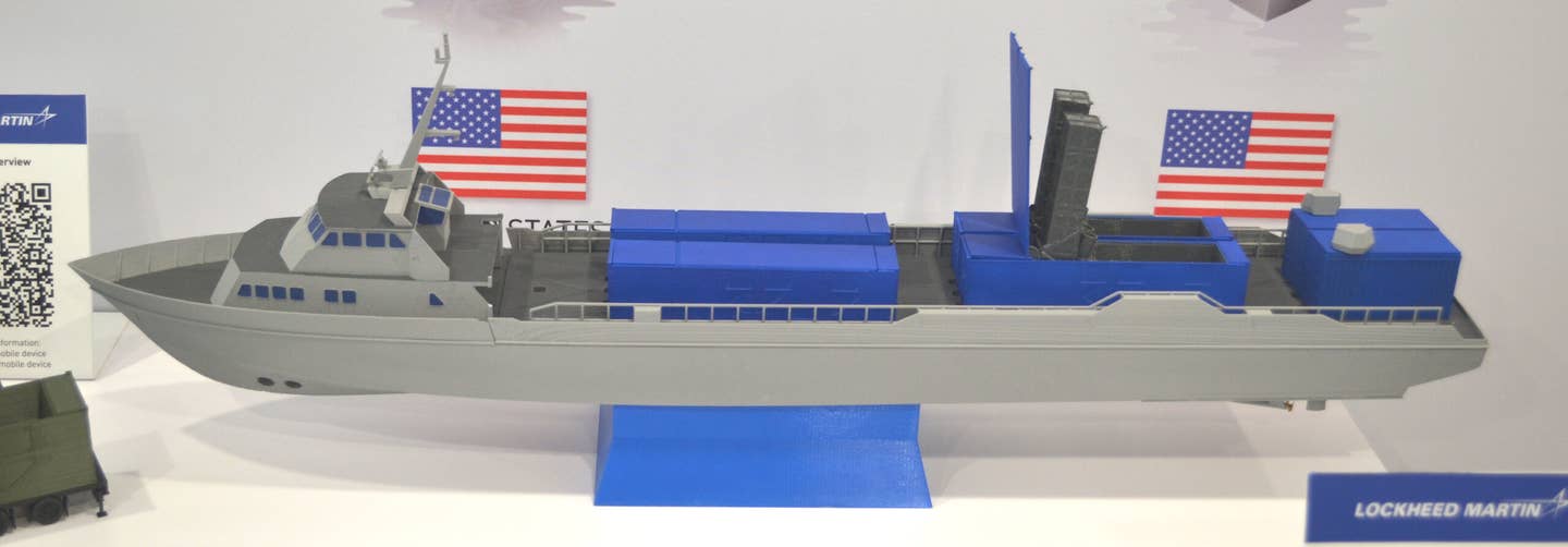 A Lockheed Martin model depicting a large uncrewed surface vessel armed with Mk 70 containerized launchers. This model also shows containers with electronic warfare systems at the rear. <em>Joseph Trevithick</em>