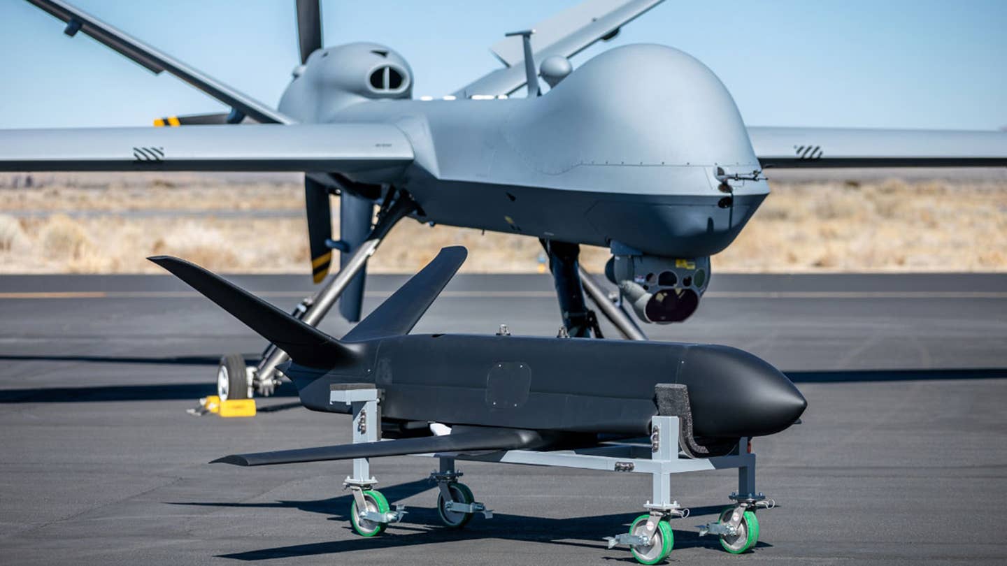 An MQ-9, at rear, with a Sparrowhawk test article, in front. Sparrowhawk is another drone General Atomics has in development that is designed to be launched and recovered in mid-air. <em>General Atomics</em>