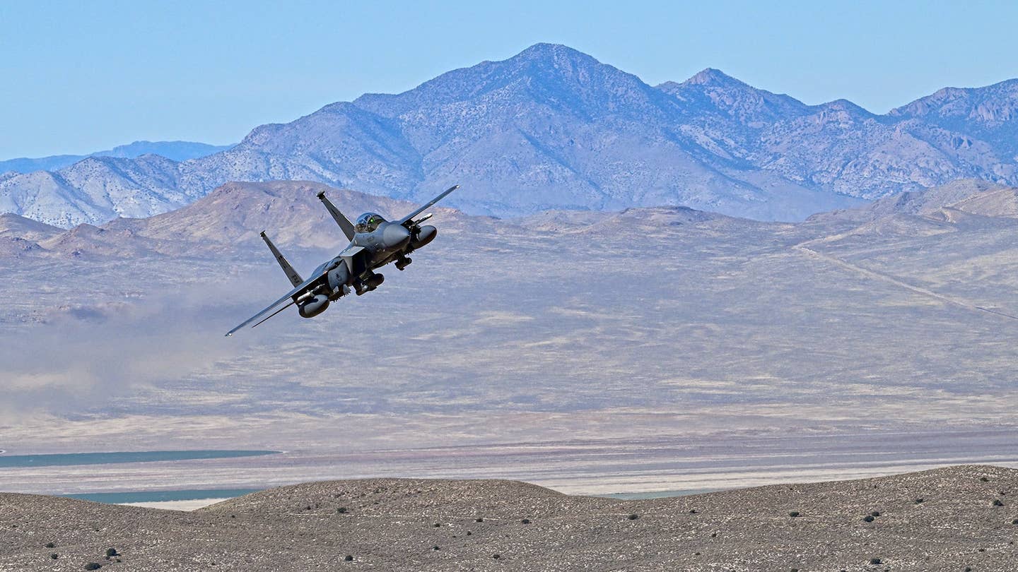 An F-15E flies on the Nevada Test and Training Range. <em>Jamie Hunter</em>