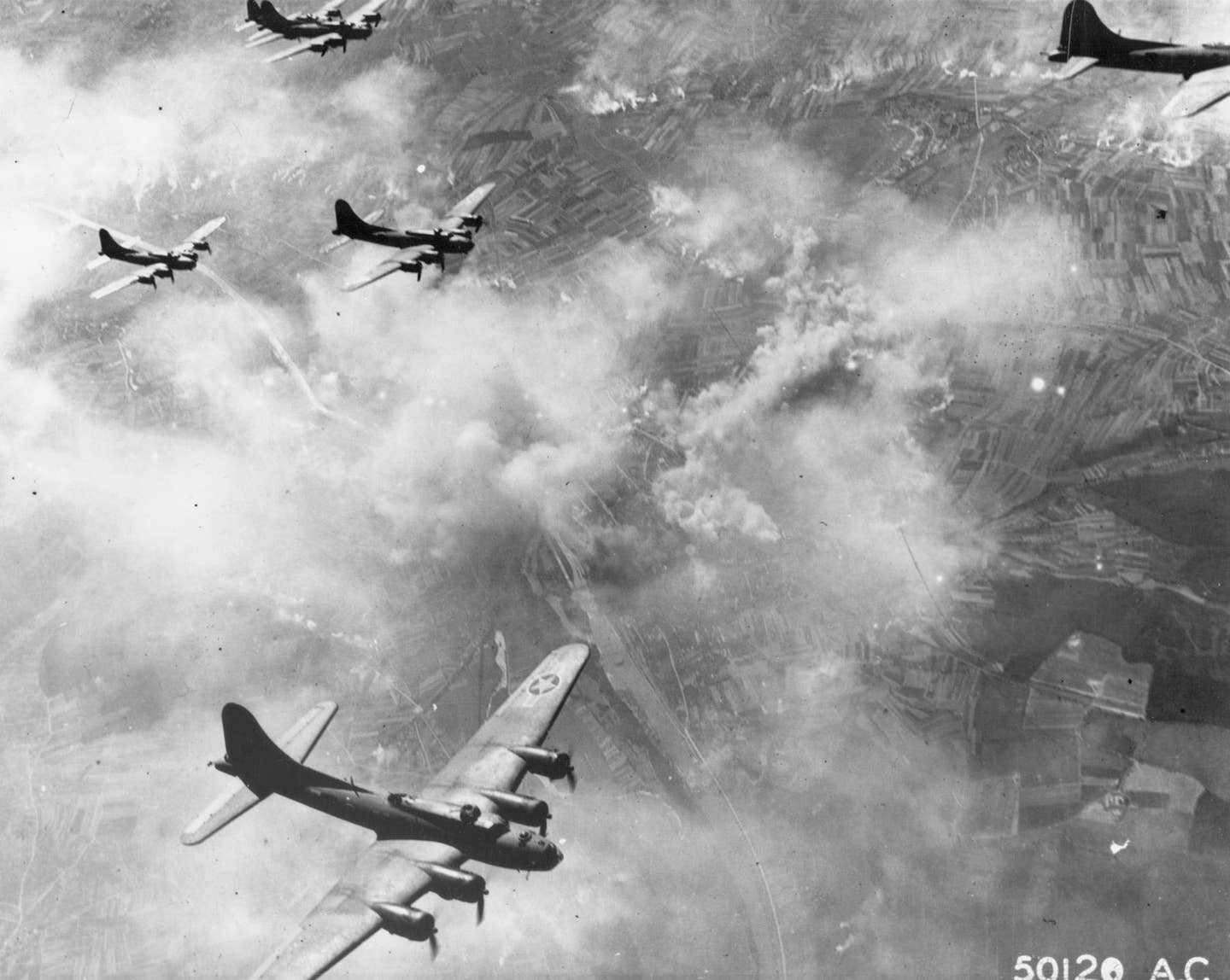 USAAF B-17Fs in formation over Schweinfurt, Germany, during an earlier raid on the ball-bearing production center on August 17, 1943. <em>U.S. Air Force photo</em>