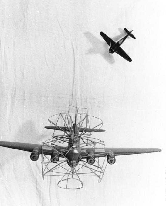 A model of a B-17E/F with latticework showing the directions of fire from its defensive machine guns, for the aid of a Luftwaffe Fw 190 fighter pilot, circa 1943–44. <em>German Federal Archives </em>