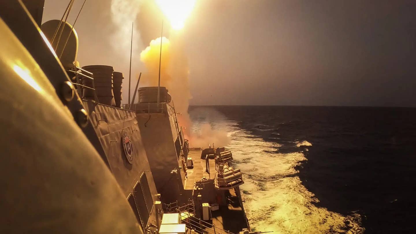 The US Navy's <em>Arleigh Burke</em> class destroyer USS <em>Carney</em> fires an SM-2 missile at Houthi aerial threats on October 19, 2023. USN