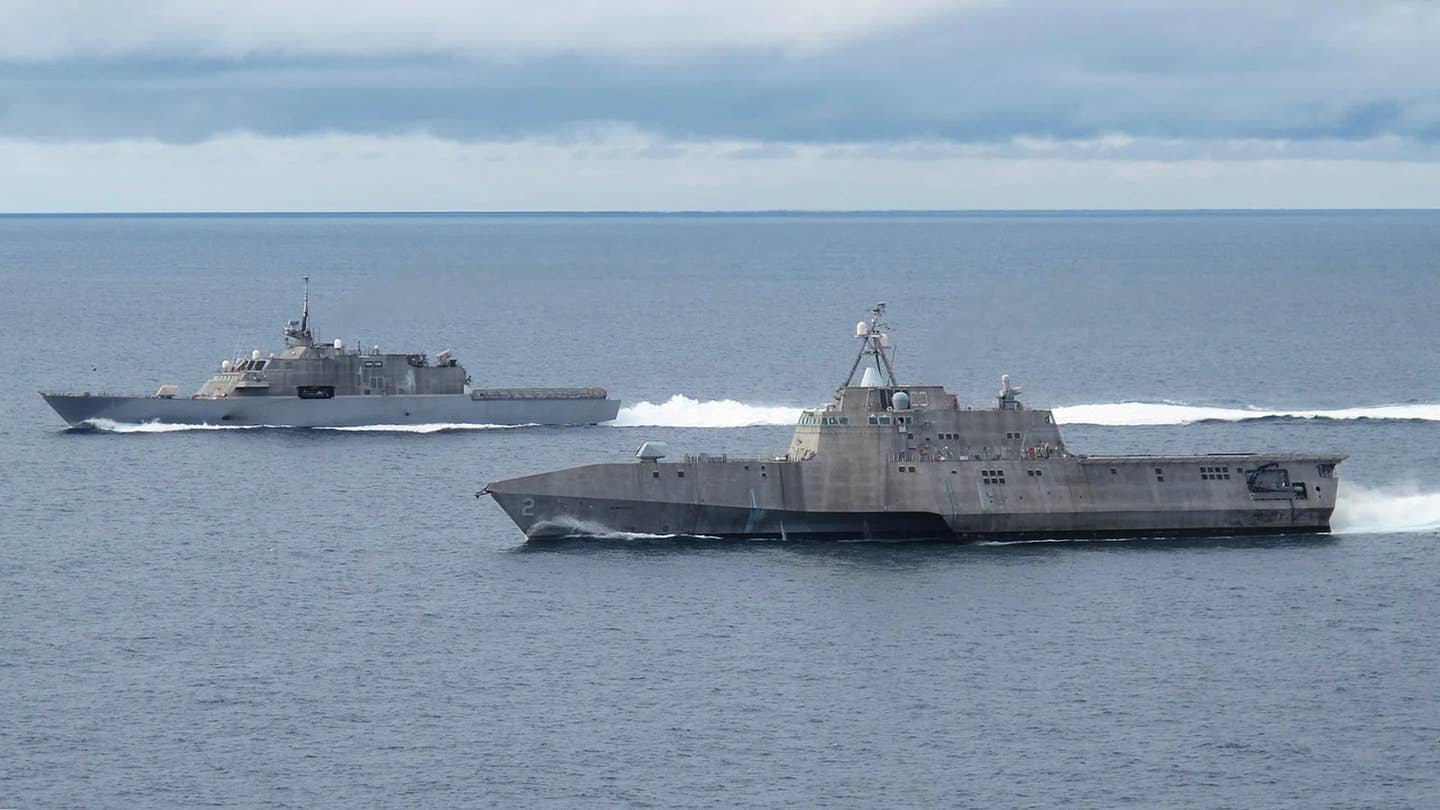 The USS <em>Freedom</em>, at rear, sails alongside the USS <em>Independence</em>, in the foreground. The lead ships in both of their classes of Littoral Combat Ships (LCS), these vessels were both been decommissioned in 2021. <em>USN</em>