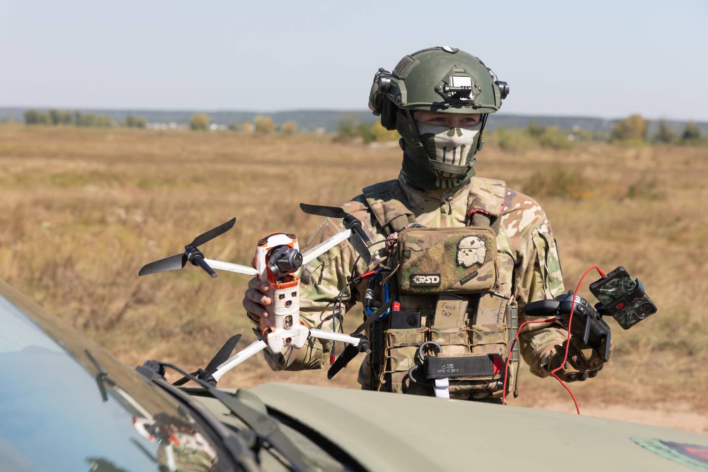 A drone operator from the field medicine division Hospitallers is seen preparing to launch a quadrocopter to search for the wounded on the battlefield. (Photo by Mykhaylo Palinchak/SOPA Images/LightRocket via Getty Images)