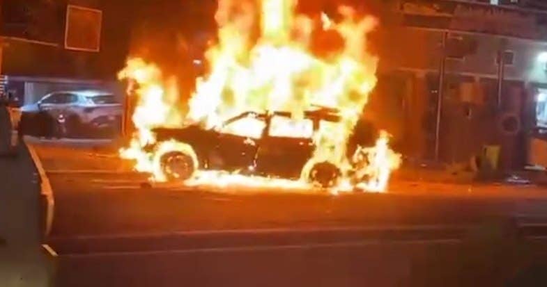An image of the burning car in Baghdad struck by a U.S. drone. (Al Mayadeen Telegram)