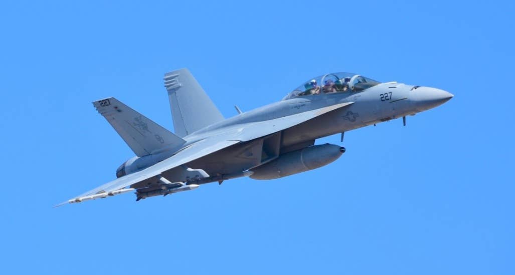 A US Navy F/A-18F Super Hornet carrying the drop tank-based IRST system. <em>DOD</em>