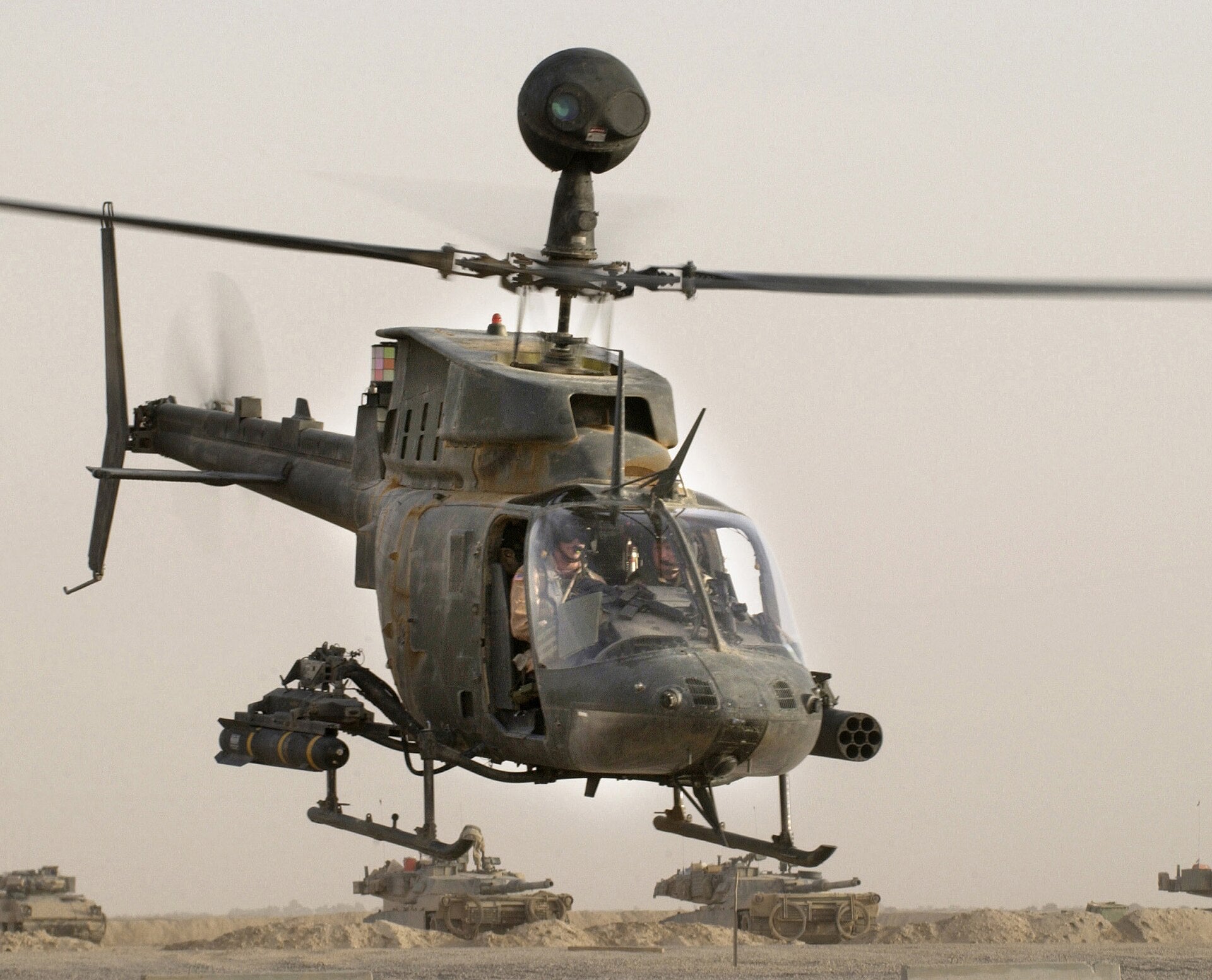 An OH-58D Kiowa Warrior helicopter from 1-4, Cavalry, 1st Infantry Division takes off from Forward Operation Base MacKenzie, Iraq for a mission Oct 23, 2004 during Operation Iraqi Freedom.  USAF photo by Staff Sgt. Shane A. Cuomo (RELEASED)