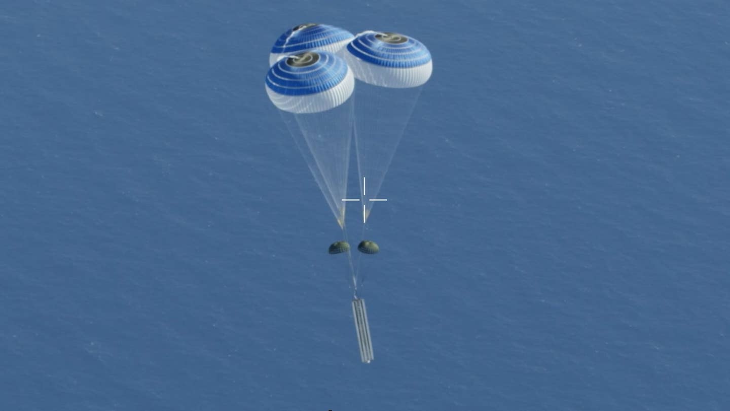 The surrogate MRBM, vertically oriented and still on its pallet, after the deployment of the additional parachutes. <em>MDA</em>