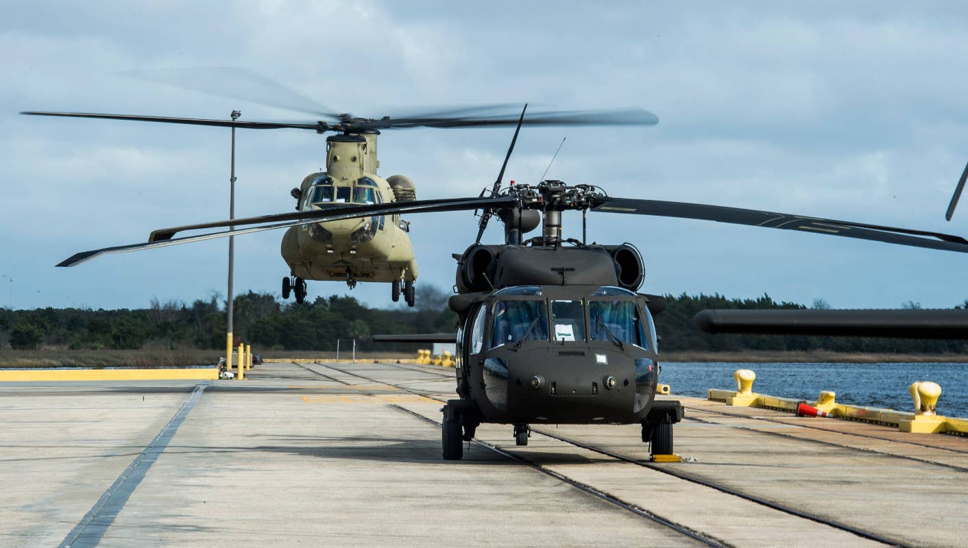 A US Army CH-47F Chinook comes in to land behind one of the service's UH-60 Black Hawks. <em>USAF</em>