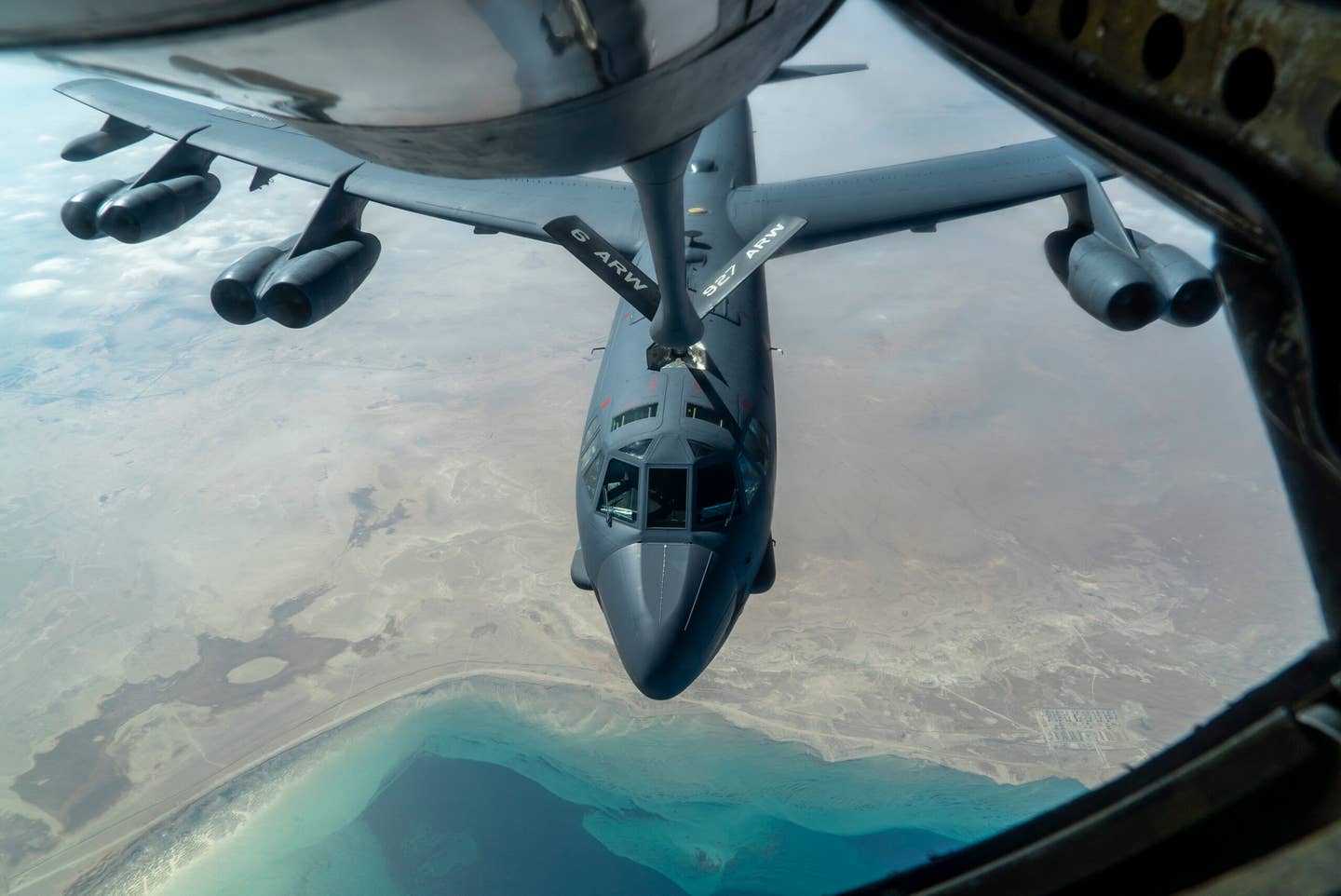 A U.S. Air Force B-52H “Stratofortress” from Minot Air Force Base, N.D., is refueled by a KC-135 “Stratotanker” in the U.S. Central Command area of responsibility Wednesday, Dec. 30, 2020. (Senior Airman Roslyn Ward/U.S. Air Force via AP)