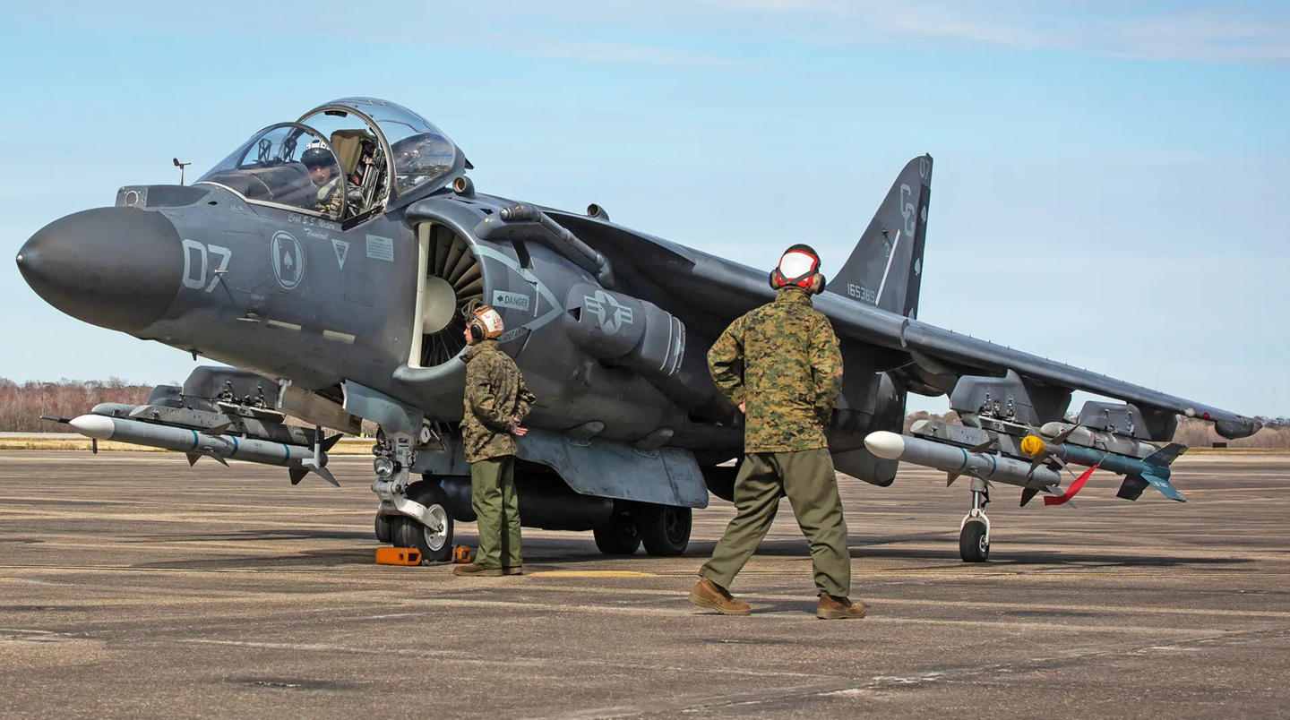 An AV-8B loaded with AIM-9M and AIM-120B captive training rounds prepares for a sortie. <em>U.S. Marine Corps photo by Cpl. Cody Rowe</em>