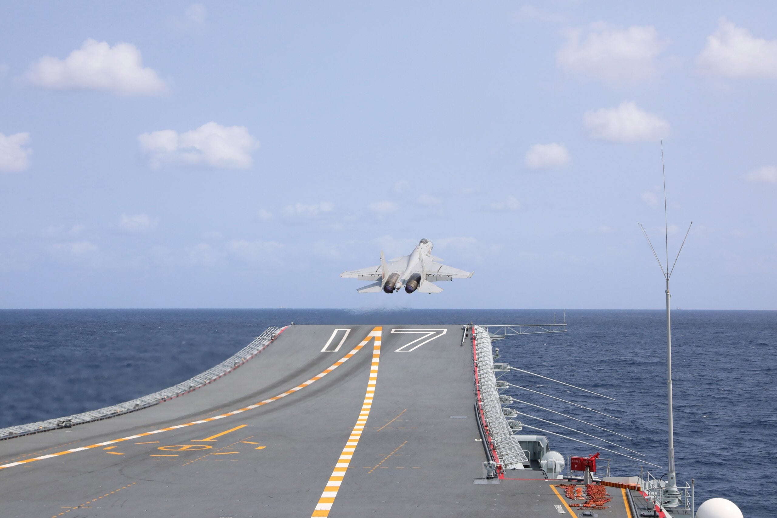 This photo taken on April 9, 2023 shows a J-15 fighter taking off from aircraft carrier Shandong during the combat readiness patrol and military exercises around the Taiwan Island by the Eastern Theater Command of the Chinese People's Liberation Army PLA. The Eastern Theater Command of the PLA has accomplished all tasks in the combat readiness patrol and military exercises carried out from April 8 to 10 around the Taiwan Island.The operations have comprehensively tested the integrated joint combat capability of the PLA's multiple services and arms under actual combat conditions. (Photo by An Ni/Xinhua via Getty Images)