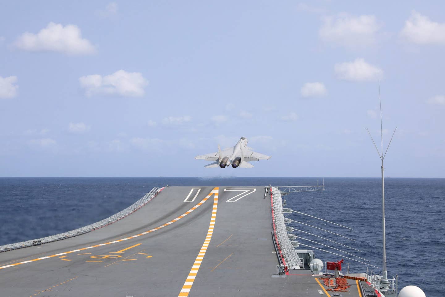 A J-15 takes off from the ski jump ramp on the aircraft carrier <em>Shandong</em> during military exercises around Taiwan in April 2023. <em>Photo by An Ni/Xinhua via Getty Images</em>