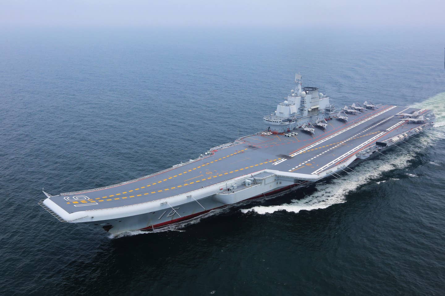 The first Chinese aircraft carrier, <em>Liaoning</em>, during a training mission in July 2017. <em>Xinhua/Zeng Tao via Getty Images</em>