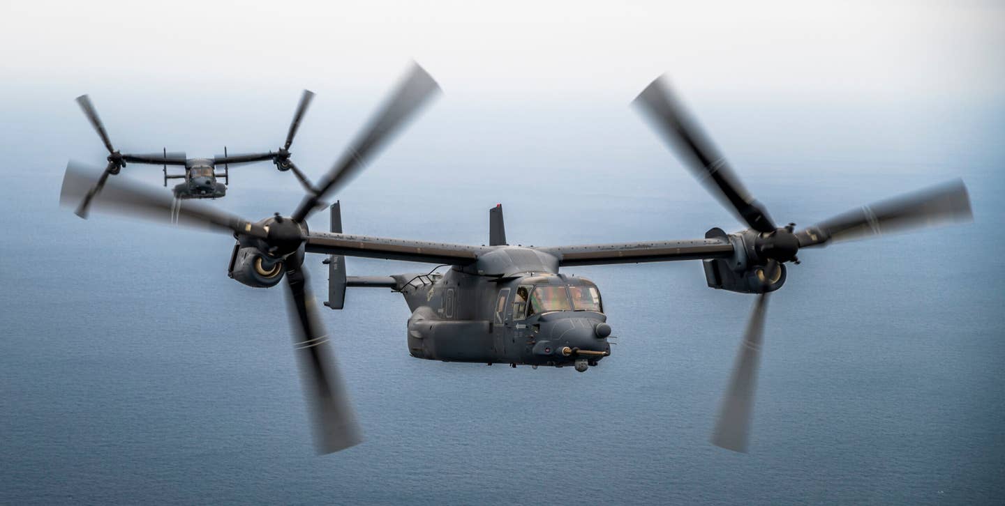 CV-22 Ospreys assigned to the 21st Special Operations Squadron approach an MC-130J  Commando II for aerial refueling over the Sea of Japan, March 17, 2023. <em>U.S. Air Force photo by Senior Airman Trevor Gordnier</em>