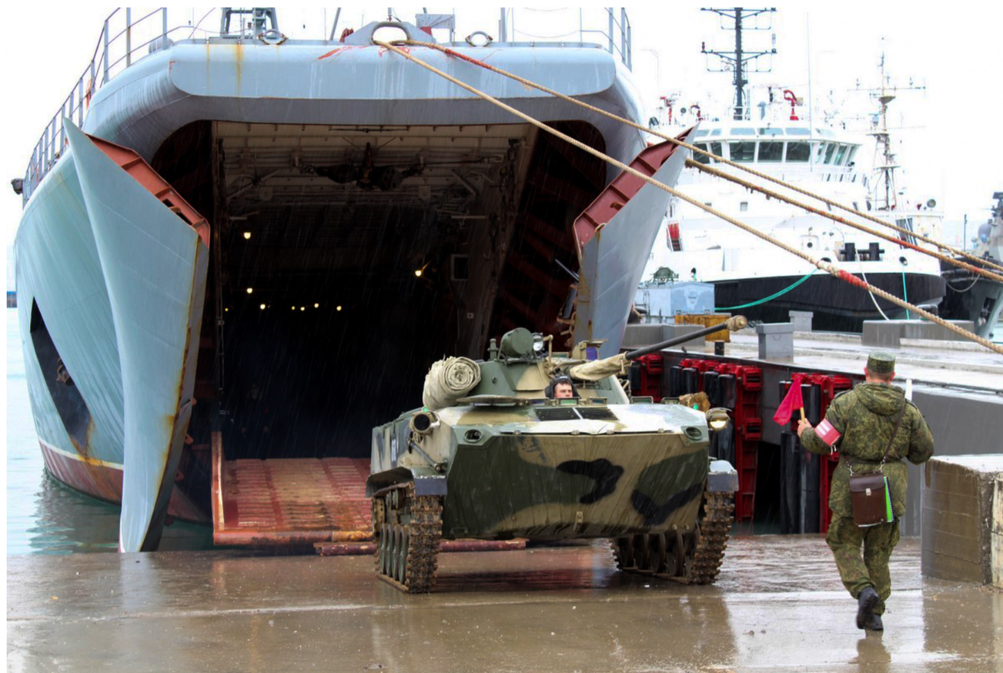 A BMD airborne amphibious tracked infantry fighting vehicle disembarks from the <em>Cesar Kunikov</em>. <em>Russian Ministry of Defense</em>